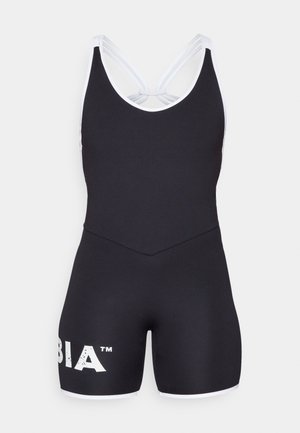 Schwarzes Sportbadewanze mit einer figurbetonten Passform, ausgestattet mit weißen Akzenten und einem Logo am linken Bein. Der Rücken mit Kreuzträger-Detail ist sichtbar.