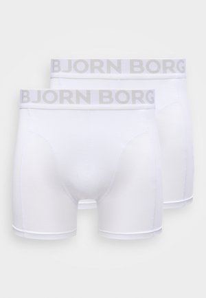 Boxer blancos hechos de material suave, con una cintura gris con el logo "BJORN BORG" y costuras lisas, con un ajuste ceñido y piernas de longitud media.