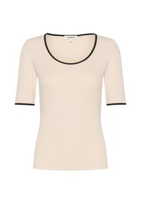 Short-sleeved beige top with a rounded neckline, featuring black trim at the collar and sleeve edges. Made from a smooth, lightweight fabric.