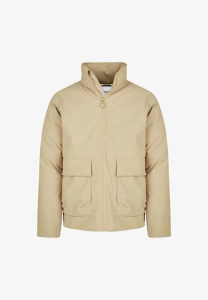 Beige lightweight jacket with high collar, front zipper, and two large flap pockets. Smooth texture, casual design, suitable for layering.