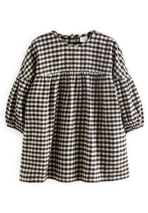 Robe à carreaux vichy noir et blanc avec manches longues bouffantes et un empiècement froncé, fabriquée en tissu texturé.