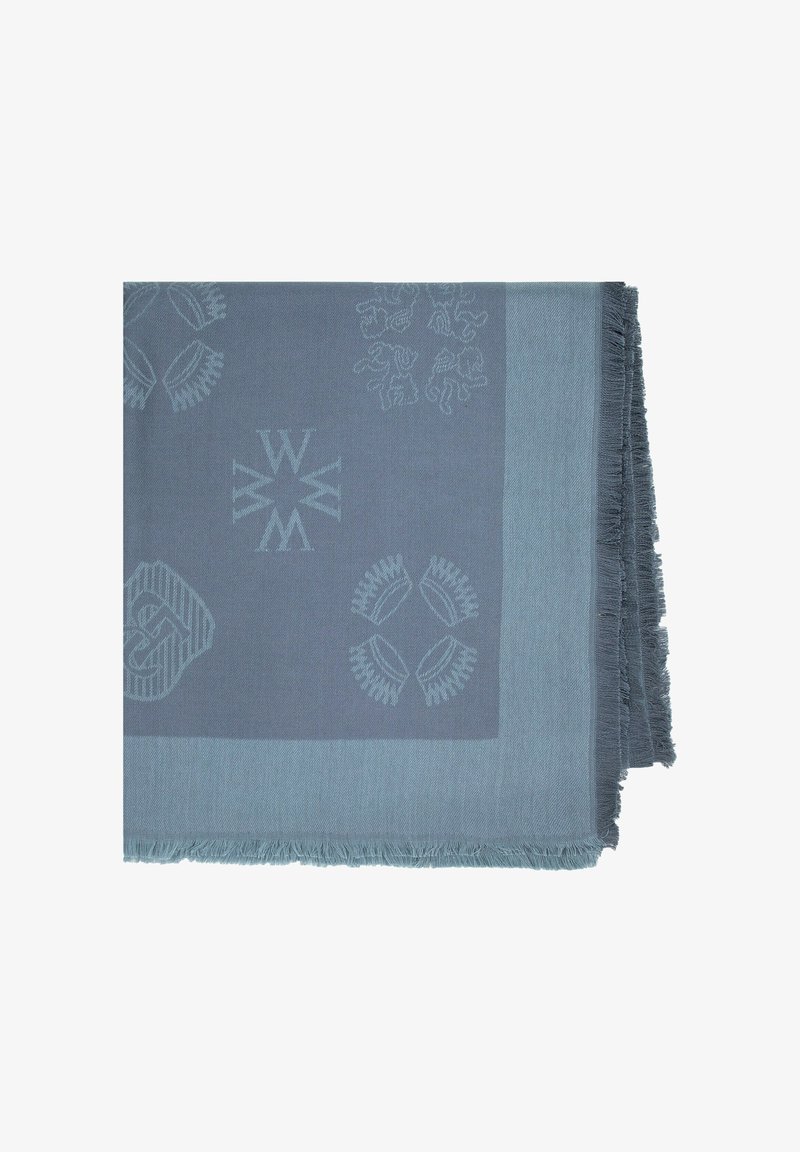 Couverture douce en tissu tissé dans des tons de bleu atténués. Présente des motifs et textures complexes, avec des bords à franges. Légère et fabriquée à partir de fibres naturelles.