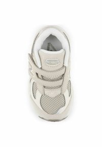 Light gray athletic shoe with mesh and suede materials, featuring two adjustable velcro straps and a cushioned insole.