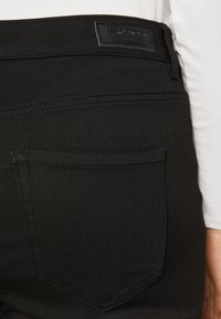 Vero Moda Curve Jean flare - black