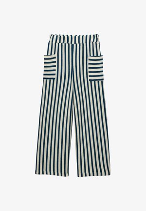 Pantalon large avec des rayures verticales bleu marine et blanches, avec deux poches plaquées à rayures horizontales sur les côtés avant.