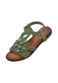 Grüne geflochtene Sandale mit dekorativen Steinen, die ein geflochtenes Design im Obermaterial, eine weiche, beige Fußbett und eine abgerundete Zehenform bietet.