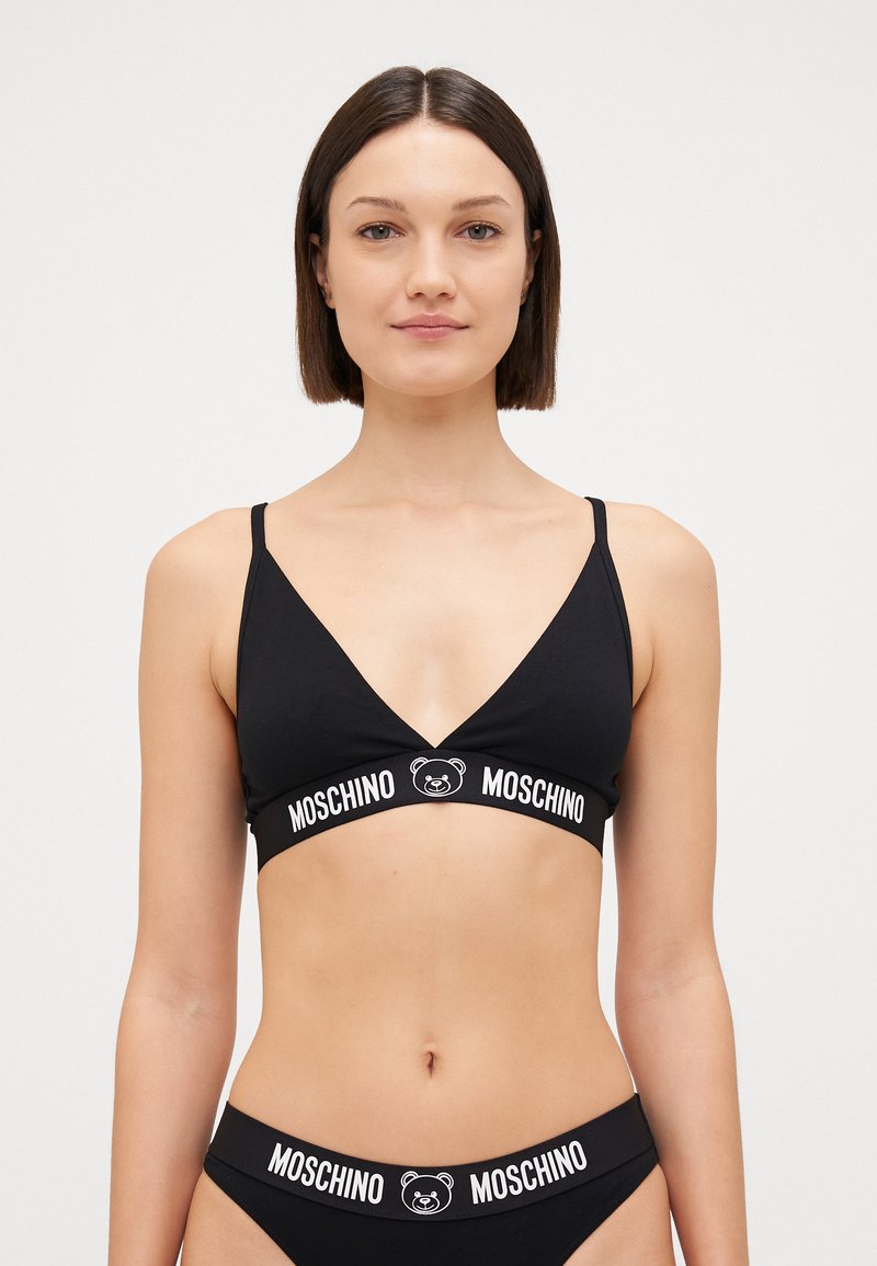 Black bralette and matching bikini bottom featuring a triangular design, thin straps, and a band with a bear logo and "Moschino" text.