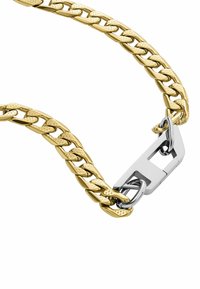 Bransoletka w kolorze złotym, z łączonymi ogniwami; posiada wyraźny srebrny zapięcie i teksturowane akcenty na ogniwach.