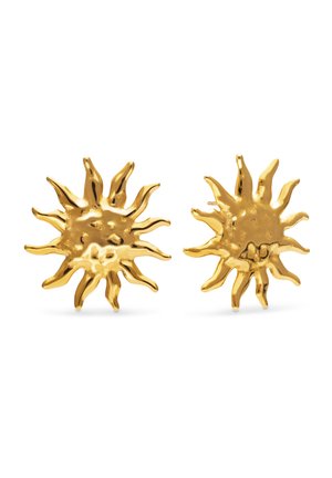 Pendientes de botón dorados con forma de sol y rayos irregulares y texturizados sobre fondo blanco.