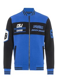 Blaue und schwarze zip-up Jacke mit gerippten Bündchen und Saum, mit besticktem Text und Zahlen sowie Seitentaschen.