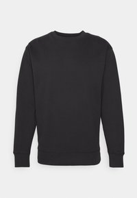 Felpa nera realizzata in un misto di cotone, con collo a giro, maniche lunghe e polsini a coste, con un logo discreto sulla parte anteriore.