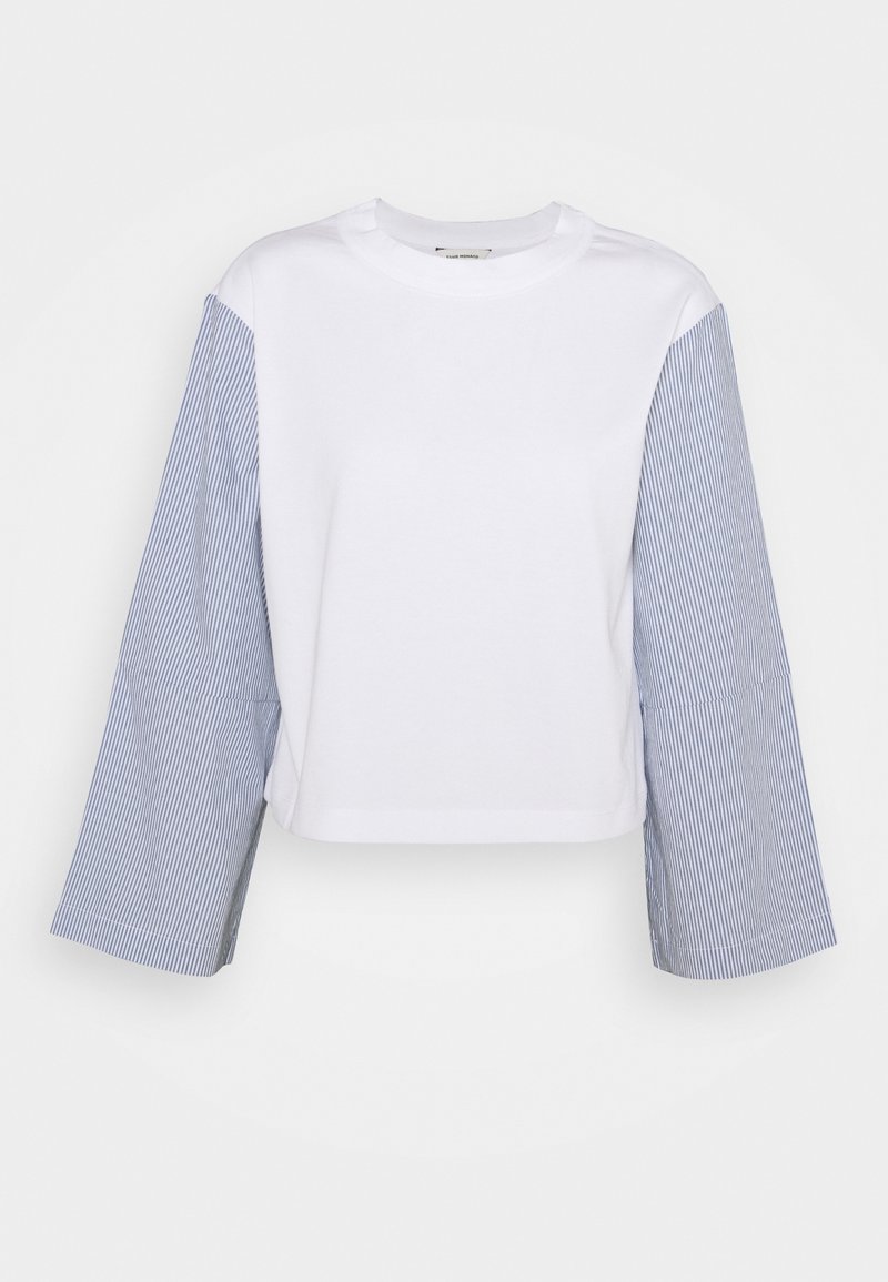 Cropped t-shirt with a white body and blue striped long sleeves. Made of cotton with a soft texture, featuring a round neck design.