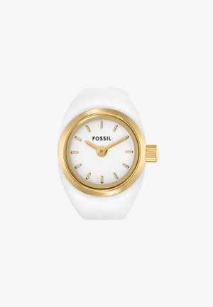 Montre blanche avec une finition brillante, lunette et marqueurs d'heure en ton doré, cadran blanc et couronne dorée texturée. Nom de la marque "FOSSIL" visible.