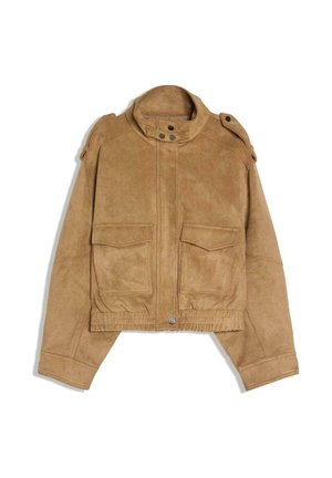 Tan suede cropped jacket with high collar, buttoned shoulder straps, two front flap pockets, and elastic waistband detail.