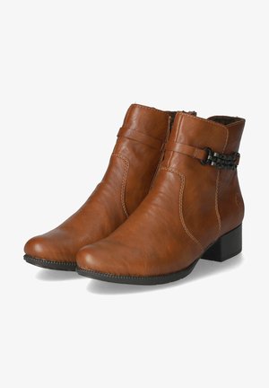 Brown leather ankle boots with a low block heel, featuring a decorative black chain accent and detailed stitching along the sides.