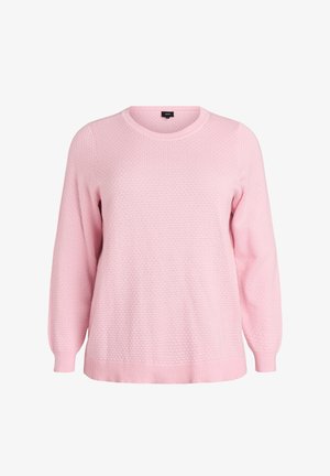 Šviesiai rožinė megzta svarkelis su tekstūruotu raštu, apvaliu kaklu ir banguotais rankovių bei apvado kraštais. Ilgos rankovės su laisvu siluetu.