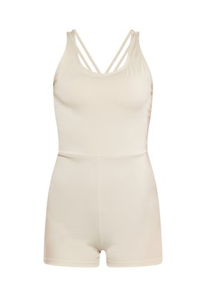 Bodycon senza maniche color beige chiaro con spalline incrociate, design aderente e texture liscia, caratterizzato da una costruzione senza cuciture e una lunghezza corta.