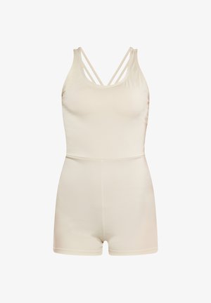 Vaaleanbeige ilmanhiha bodysuit, jossa on ristikkäiset hihnat, tiukka muotoilu ja sileä pinta, saumaton rakenne ja lyhyt pituus.
