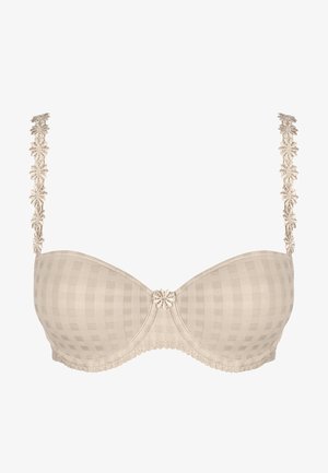 Beige pehmeä rintaliivi ruudullisella kuviolla, pitsinauhat ja kukka-akseli keskellä. Pehmeä rakenne ja kontrastivärit yksityiskohdat.