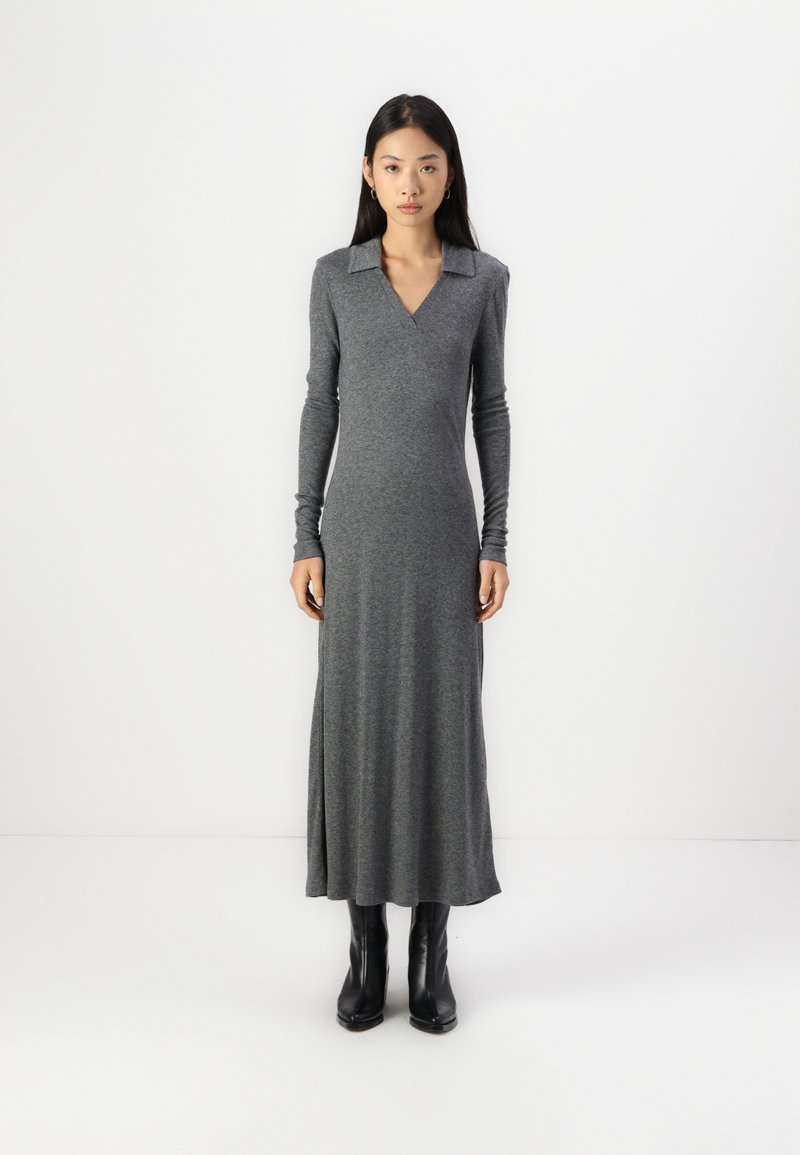 Long gray dress with a V-neck and collar, made from a soft, stretchy fabric. Features long sleeves and a fitted silhouette, reaching mid-calf.