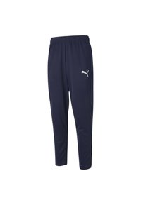 Navy blue athletic pants with a smooth texture, elastic waistband, tapered legs, and a white Puma logo on the side.