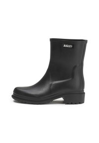 Black rubber ankle boots with a smooth texture, rounded toe, and grooved sole. Features a logo label on the outer side.