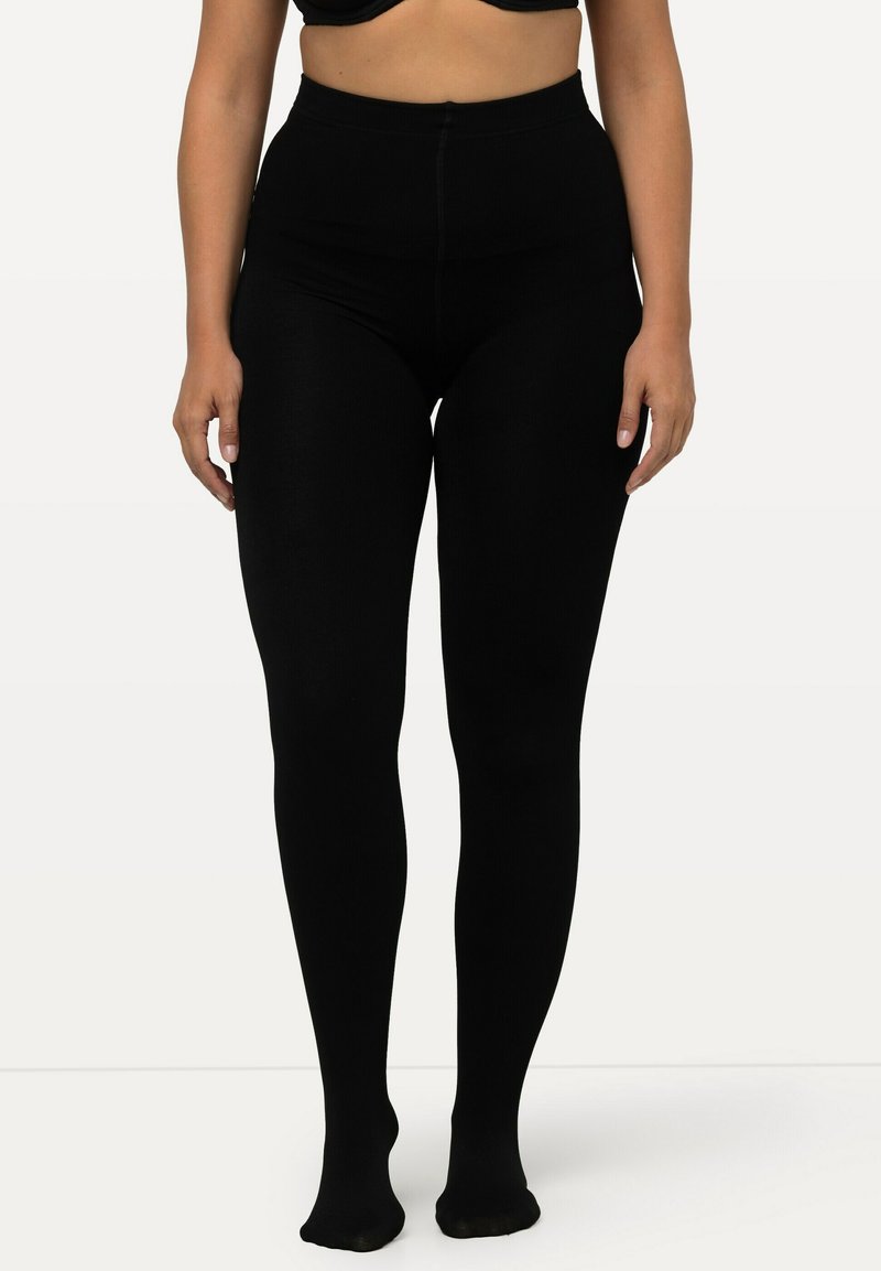 Collant neri a costine con vita alta, realizzati in un tessuto elastico. Texture liscia e design opaco, che si estende appena sopra la caviglia.