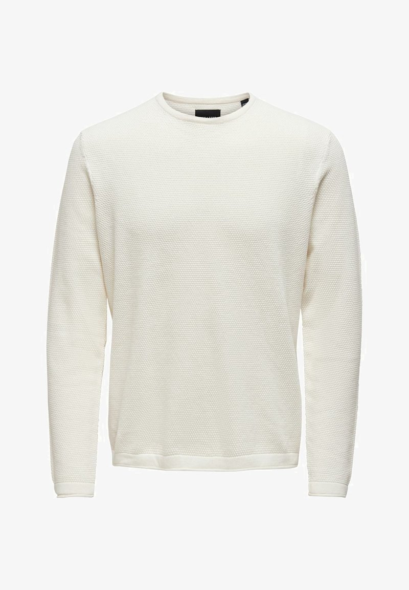 Sweat-shirt à manches longues de couleur crème avec un design texturé en maille gaufrée, poignets côtelés et encolure ronde. Simple et polyvalent.