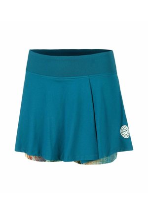 Falda-pantalón deportivo en verde azulado con cintura ancha, detalle de pliegues, shorts interiores estampados y pequeño logo redondo en la parte inferior derecha.