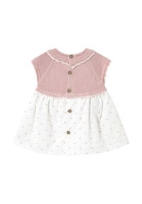 Top de punto rosa con cuello festoneado y mangas cortas, acompañado de una falda blanca con un patrón floral en rosa y botones de madera en el centro.