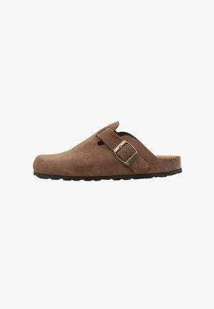 Brown suede clogs with a rounded toe, featuring a side buckle and a textured black sole. Simple design, open back for easy wear.