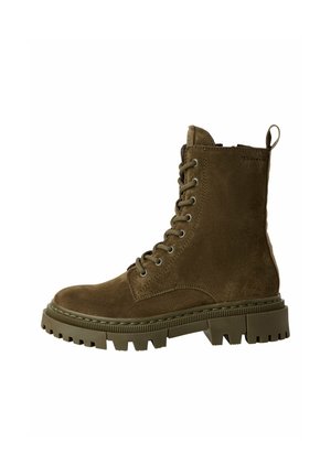 Stivaletto alla caviglia in suede verde oliva con punta tonda, design con lacci e suola in gomma robusta con battistrada pronunciato per una migliore aderenza.