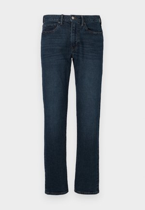 Jeans en denim bleu foncé avec une coupe droite, dotés d'une taille à bouton, d'un design à cinq poches et d'un léger décoloration sur les cuisses.