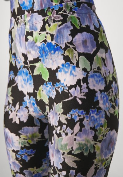 Floral leggings featuring a black background with blue, purple, and green flowers. Made of a smooth, stretchable material with intricate patterns.