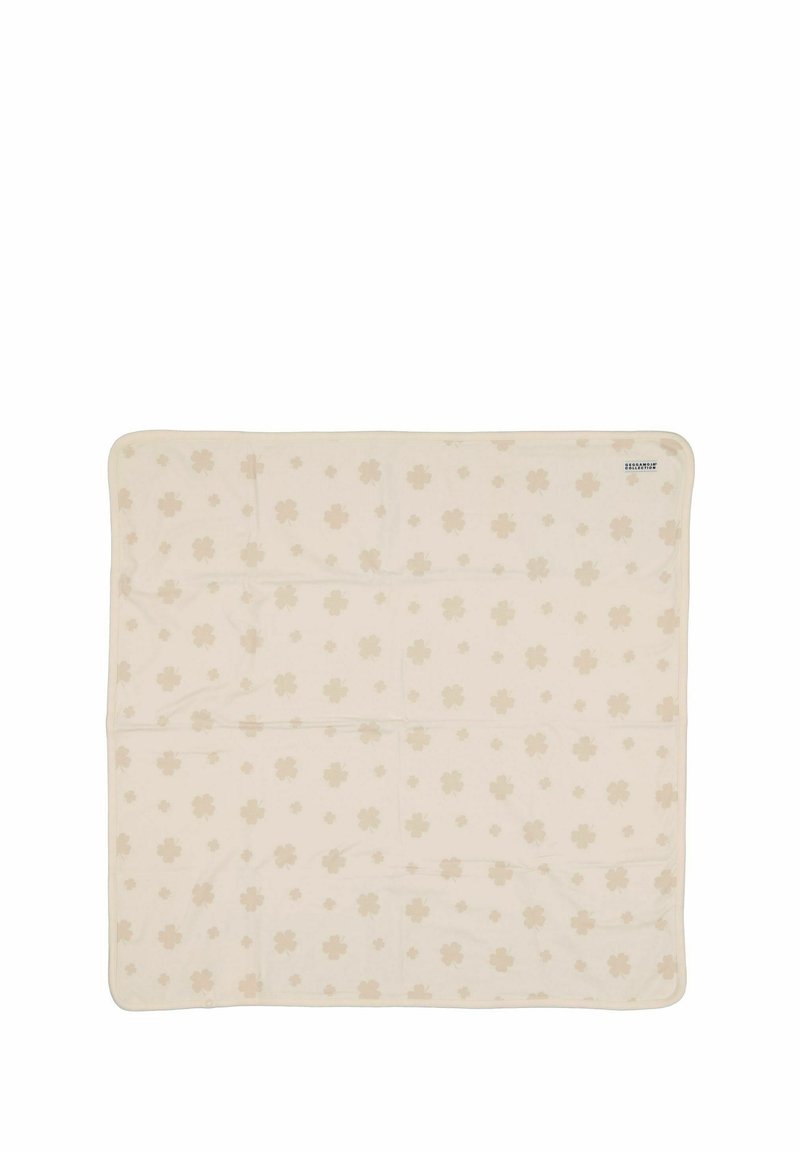 Krämbelädd med ett heltryck mönster av subtila blommor i en något mörkare krämfärg. Mjuk textur med rundade hörn.