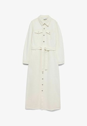 Pikk kreemikas värvi teksariidest kleit, millel on krae, esiotsa nööpidega sulgemine, rinnataskud, pikad varrukad ja vöörihm vöökoha ümber.