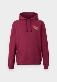 Sweat à capuche bordeaux avec poche frontale, cordons et petit logo "Tommy Jeans N.Y." sur la poitrine gauche.