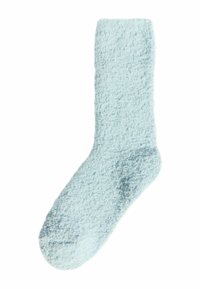 Calcetín esponjoso de color azul claro con una textura suave, que presenta una parte superior lisa y una punta redondeada. Sin patrones visibles ni herrajes.
