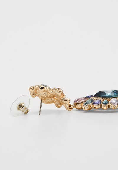 Gold-tone earring with multi-faceted gemstones in blue, purple, and clear. Features a textured backing and a clear glass backing piece.