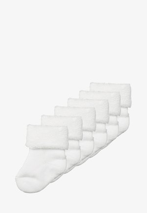 White ankle socks featuring a plush, fuzzy cuff, made from soft material; displayed in a set of six with a smooth texture.