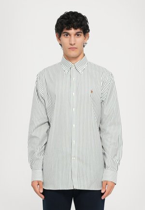 White button-up shirt with vertical green stripes, long sleeves, and a small embroidered logo on the left chest. Smooth fabric texture.