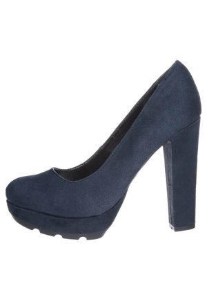 Navy blue high-heeled pumps with a rounded toe, suede texture, and a platform midsole. Features a thick block heel for stability.