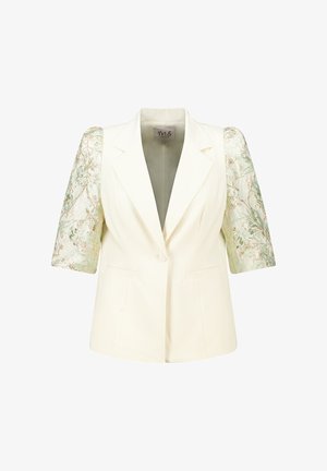 Korte blazer van een crèmekleurige stof met korte, gestructureerde mouwen die een groen-gouden bloemenpatroon hebben. Met gepunte revers en voorzakken.