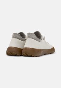 White leather shoes with a grey knitted collar and brown rubber sole, featuring simple lace design and textured tread for grip.
