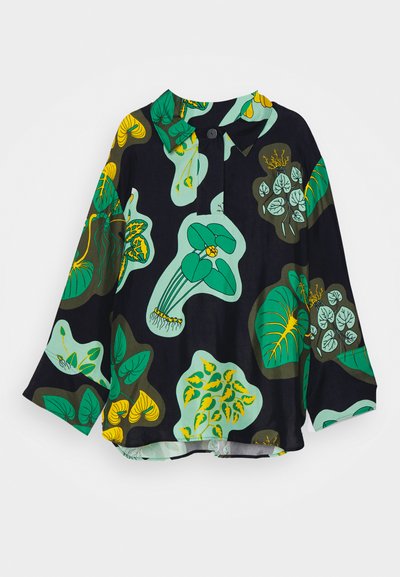 Long-sleeve shirt featuring a dark background with bold green and yellow plant patterns. Made from a soft fabric with a pointed collar and button closure.