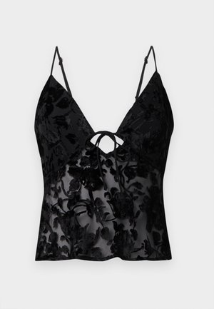Sort cami med tynde stropper, med blomsterprint i vælvet overlay på gennemsigtig stof; v-udskæring og bindebånd foran.