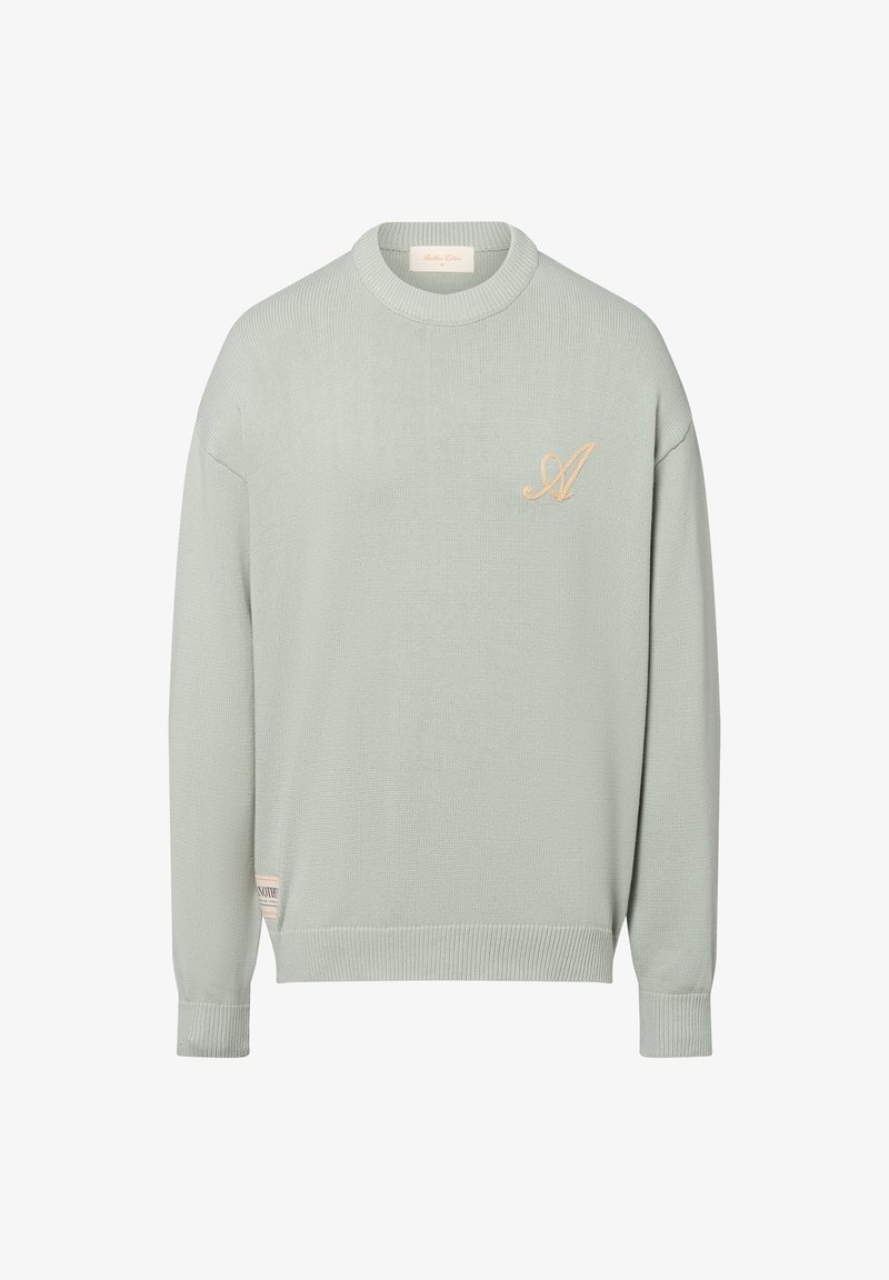 Pull en maille vert clair avec texture côtelée, col rond et logo brodé en beige. Dispose de manches longues et d'une étiquette sur le côté.