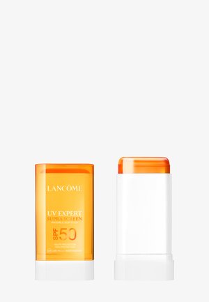 Lancôme UV Expert Supra Screen näkymätön aurinkopuikko SPF 50, oranssin korkin ja valkoisen pohjan kanssa esitetty.