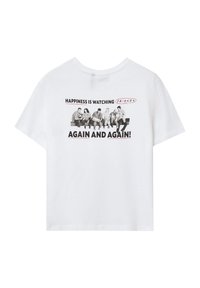 T-shirt bianco in cotone con una stampa grafica che presenta il testo "La felicità è rivedere FRIENDS ANCORA E ANCORA!" in nero e rosso. Maniche corte.