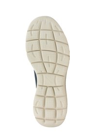 Semelle de chaussure en caoutchouc blanc avec un motif de grip texturé et des rainures de traction. Des sections translucides mettent en valeur un design de semelle distinct.